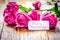 Present design with Mother`s day text and greeting-card on woode