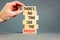 Present time symbol. Concept words There is no time like the present on wooden block. Beautiful grey table grey background.