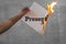 Present time text word burning on fire with paper