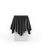 Presentation pedestal covered with a black cloth