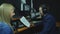 Presenters or moderators - man and woman - in radio station hosting show for radio live in Studio