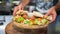 Presenting the middle eastern Lebanese dish Falafel on a wooden plate. tortilla, vegetable salad, and tahini sauce