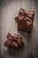Presents boxed in glittery paper with brown ribbons top view