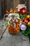 Preservation of the autumn harvest of vegetables. Glass jar with pickled tomatoes. Vegetable food. Tomato of different varieties.