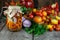 Preservation of the autumn harvest of vegetables. Glass jar with pickled tomatoes. Vegetable food. Tomato of different varieties.