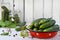 Preservation of pickling cucumber. Preparation of conservation from organic vegetables on a light background. Homemade organic cru