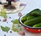 Preservation of pickling cucumber. Preparation of conservation from organic vegetables on a light background. Homemade organic cru