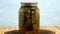 Preservations, conservation Salted pickled cucumbers in a jar on an wooden table