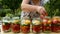 Preservations, conservation Salted pickled tomatoes in a jars on an wooden table