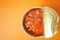 preserved canned tomato beans on color background