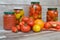 Preserved and fermented food in glass jars. Fermented food. Autumn canning. Tomatoes pickling and canning into glass jars. Canned