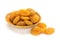 Preserved fruit. Dried sulfurized apricots in wooden bowl  on white background