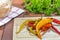 Preserved Pickled Chilli Peppers on a Chopping Board with Bread