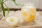 Preserved pineapple circles with juice in glass on vintage cloth