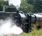 Preserved steam train Leander leaving Carnforth