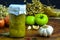 Preserved vegetarian food concept.Canned green onion in a jar on wooden background