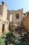 Preserved wall with the window in ruined house of abandoned ancient village Gamsutl in the Dagestan, Russia