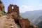 Preserved wall with the window in ruined house of abandoned ancient village Gamsutl in the Dagestan, Russia