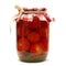 Preserves. Pickled tomato in glass on white