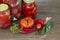 Preserves vegetables in glass on wood background, marinated fermented and pickled fermer food