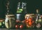 Preserving of fruits and vegetables harvest. Various preserve glass jars on dark table. Healthy way of harvest storage