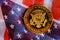 Presiden Donald Trump coin against US flag background in the election 2020