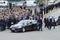 President of Ukraine Petro Poroshenko greeting people, cars and bodyguards nearby. Military parade