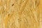 Pressed wood background texture, brown wood particle board, chipboard