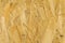 Pressed wood background texture, brown wood particle board, chipboard