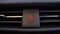 Pressing car emergency lights button on dashboard