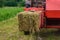 Pressing hay into bales, old working press, harvesting and harvesting dry fodder