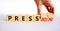 Pression to free press symbol. Businessman turns wooden cubes and changes the word pression to press. Beautiful white table, white