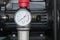 Pressure gauge on an air compressor close-up
