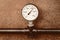 Pressure gauge on a background of vintage pipe closeup engineering design