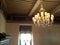 Prestigious chandelier in a room with a coffered roof