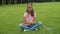 Preteen blogger girl filming video for vlog in park