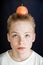 Preteen Boy Balancing Apple on Top of Head