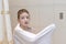 A preteen boy drying his hair with white towel - children, kid independence concept