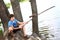 Preteen boy with fishing self made rode