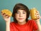 Preteen boy hold peanut butter with nut pieces