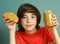 Preteen boy hold peanut butter with nut pieces