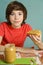 Preteen boy hold peanut butter with nut pieces