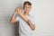 Preteen boy with slime near white wall