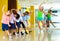 Preteen dancers practicing dance routine with female choreograph