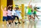 Preteen dancers practicing dance routine with female choreograph