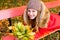 Preteen girl in autumn park with leafs