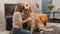 Preteen girl child hugging golden retriever dog