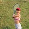 Preteen girl playing tennis