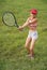 Preteen girl playing tennis