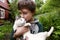 Preteen handsome boy with siberian cat